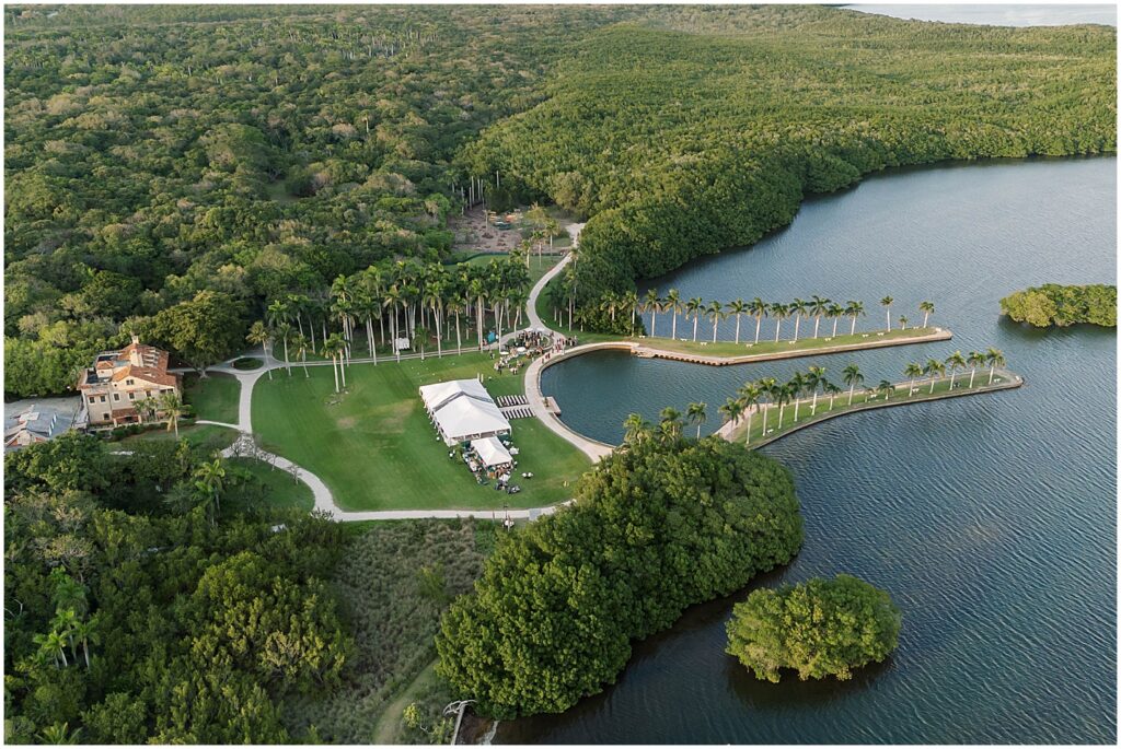 drone photo of a oceanside tented wedding in naples, florida